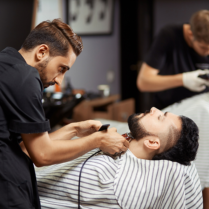 Man stylish client in barbershop